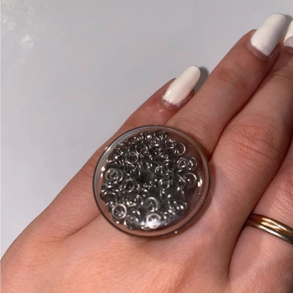 Elegant Adjustable Silver Ring filled with Moving Particles
